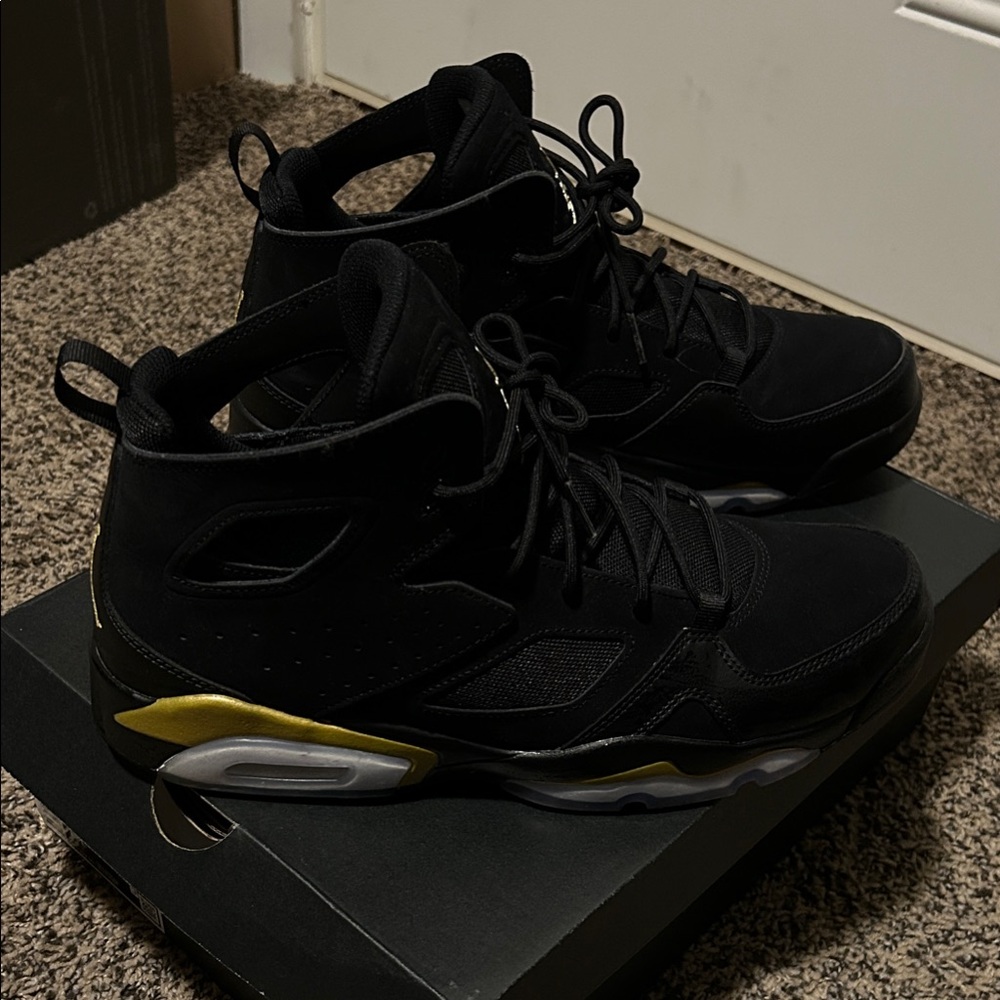 Jordan Black and Gold Sneakers